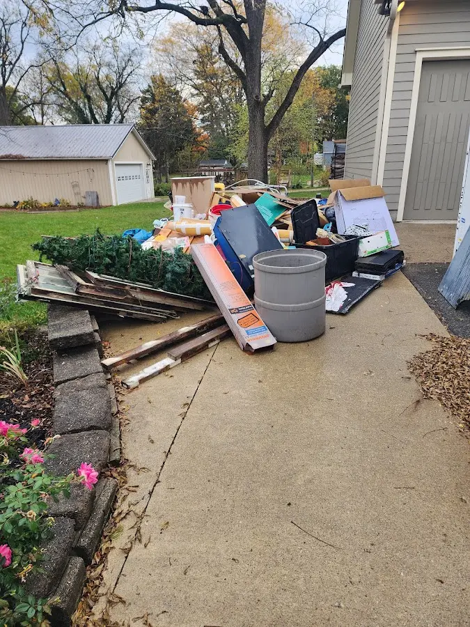 Dumpster being loaded with debris for Roofing Dumpster Rental in White City